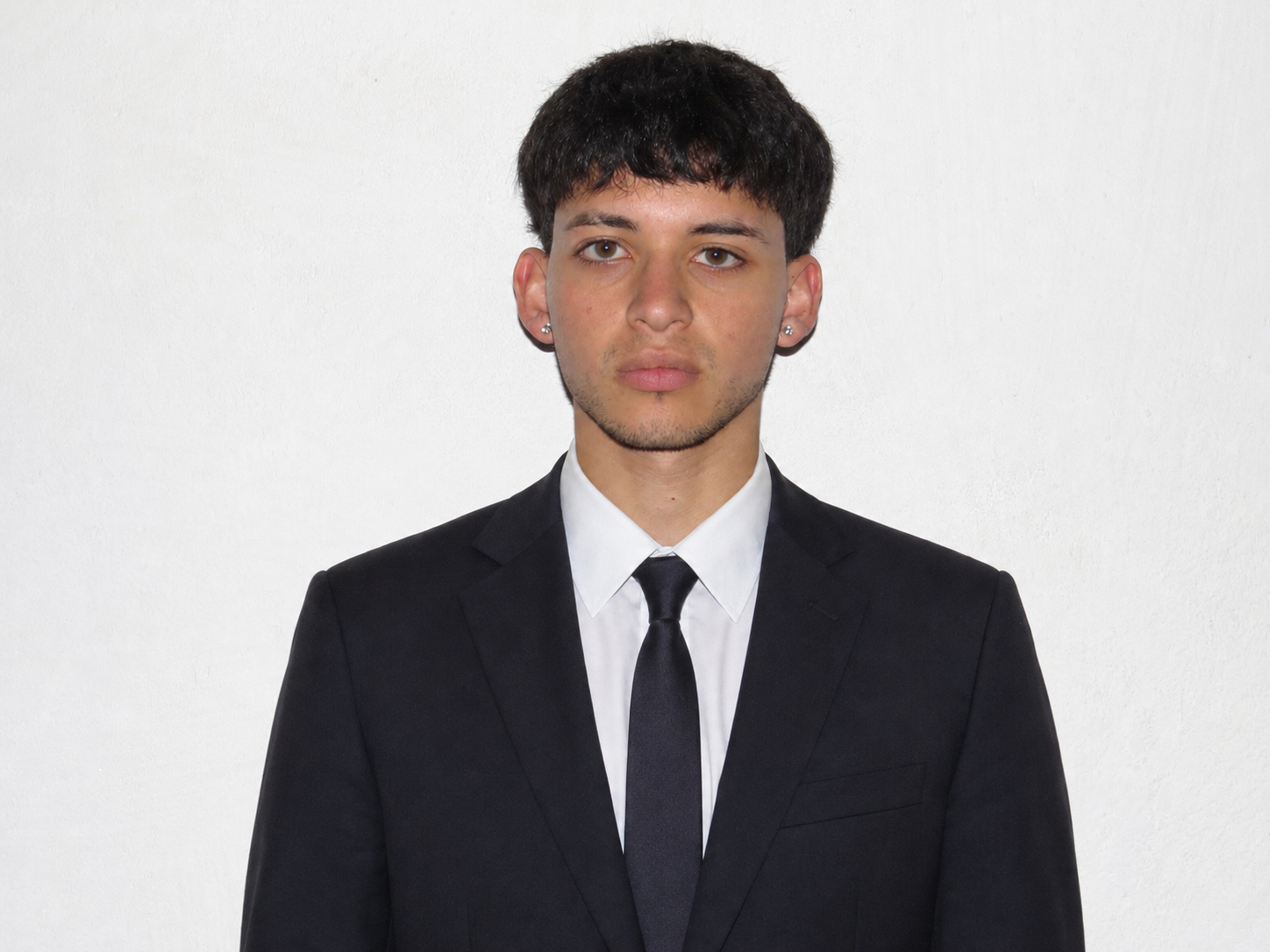Franco Sum wearing a suit.